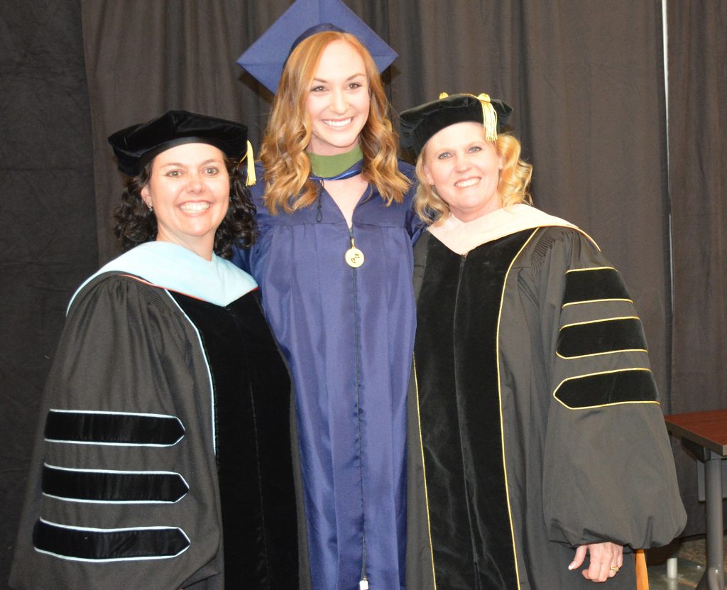 (Center) Meagan Minson, an athletic training master’s degree candidate at California Baptist University, participates in the College of Health Science hooding ceremony on May 2.